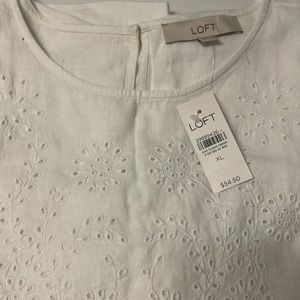 linen blend blouse embroidered details on front and sleeves..55% linen45%viscose
